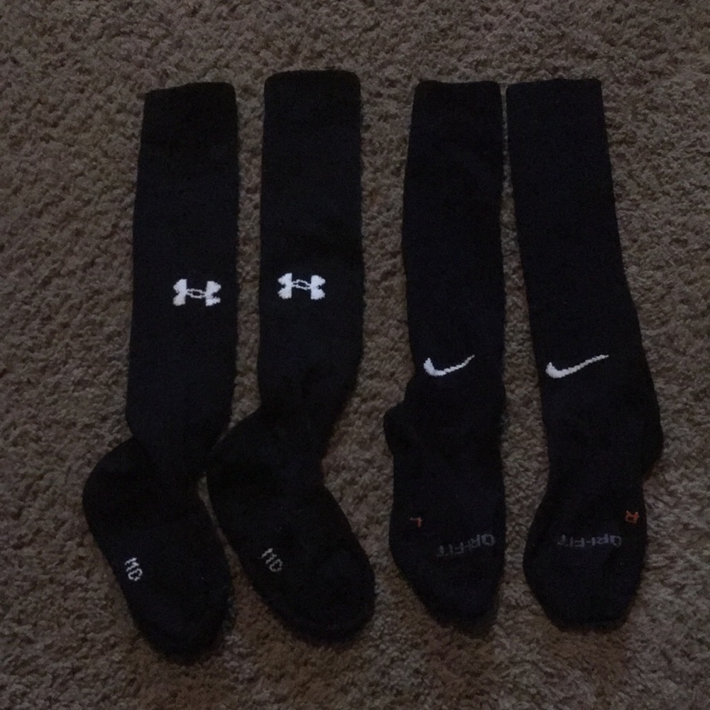 One pair black adult Under Armour & one pair Nike unisex softball/baseball socks